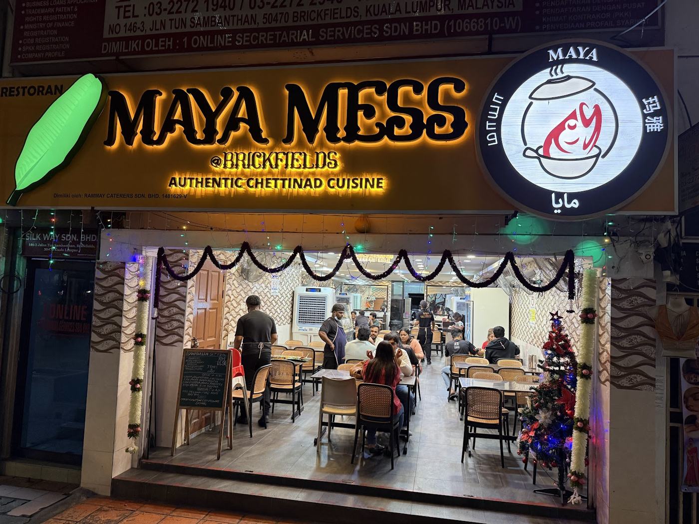 Maya Mess storefront at night